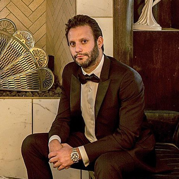 A picture of Brian Toll with a description of Co-Founder, h.wood Group